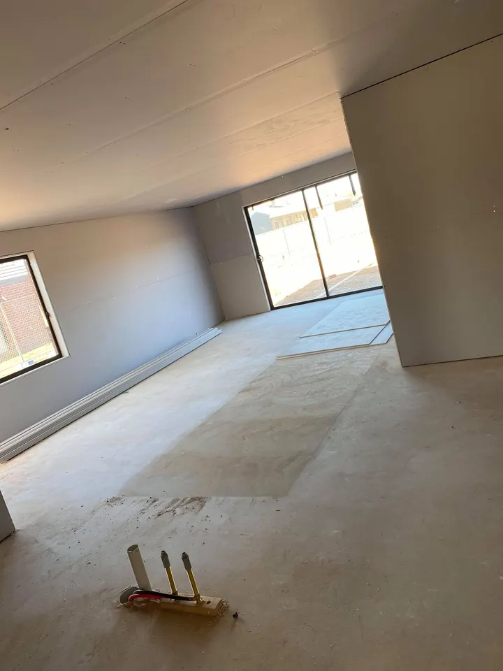 Finished room with smooth set walls and ceiling